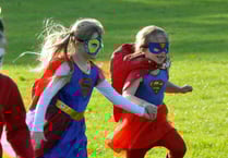 Superheroes travel a sponsored mile for cancer campaign