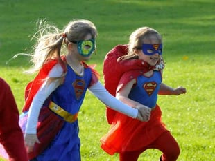 Superheroes travel a sponsored mile for cancer campaign