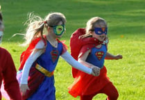 Superheroes travel a sponsored mile for cancer campaign