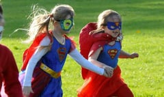 Superheroes travel a sponsored mile for cancer campaign