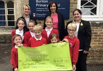 Shoppers give cash boost to school
