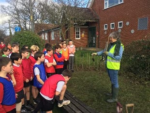 Children help out with school hedge