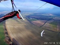 Pilot flies with a red kite over East Meon