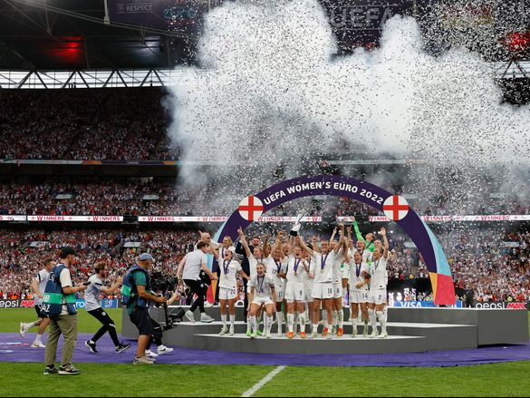 LONDON, ENGLAND - JULY 31: Leah Williamson and Millie Bright of England lift the UEFA Womenâs EURO 2022 Trophy after their sides victory during the UEFA Women's Euro 2022 final match between England and Germany at Wembley Stadium on July 31, 2022 in London, England. (Photo by Lynne Cameron - The FA/The FA via Getty Images)