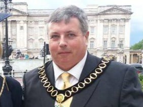 Former East Hampshire District Council leader and chairman Patrick Burridge pictured outside Buckingham Palace