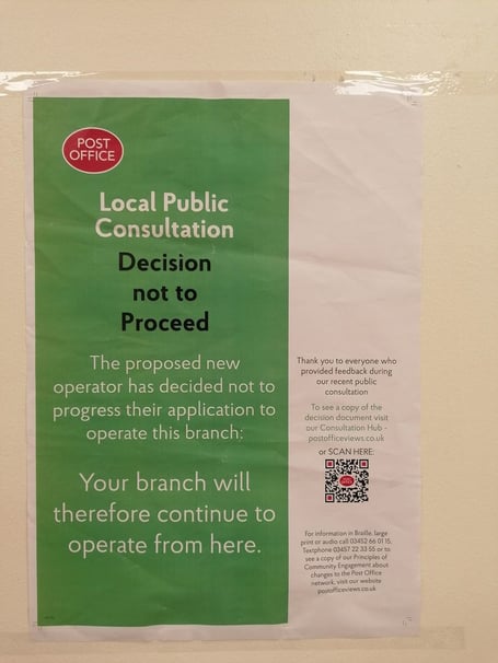 Post Office poster revealing the branch in Petersfield Square is to remain open December 2022 
