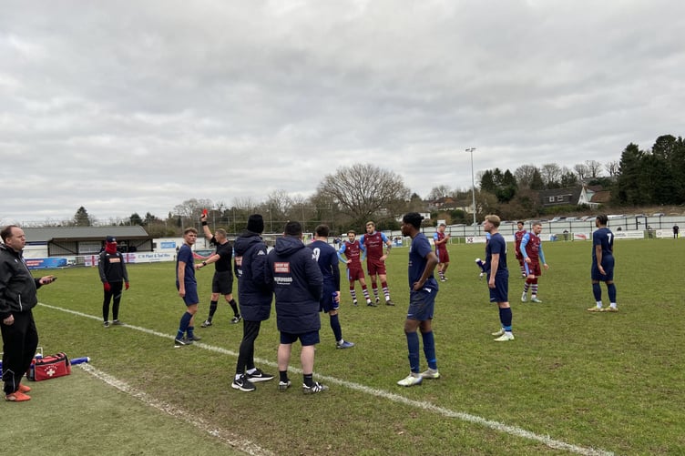 Horley Town’s Liam Steer is shown a straight red card during his side’s 3-0 defeat at Badshot Lea