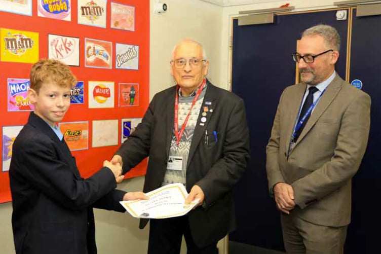 Oliver Scobie being presented with a certificate by Alton Rotary president Mike Sanders, February 2023.