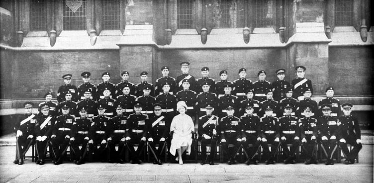 The Queen Mother sat with an unknown regiment at an unknown occasion sometime after the Second World War – can you help unravel the photograph's mysteries?