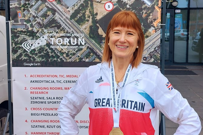 Susan Payne proudly wears the gold medal she won in Torun