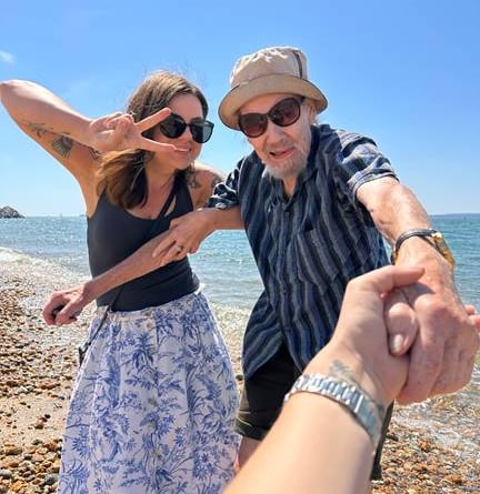 Resident Peter and Activities Coordinator Kata Beauchemin have fun on the shore