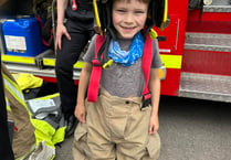 Bordon firefighters recruit seven-year-old Freddie at school fair