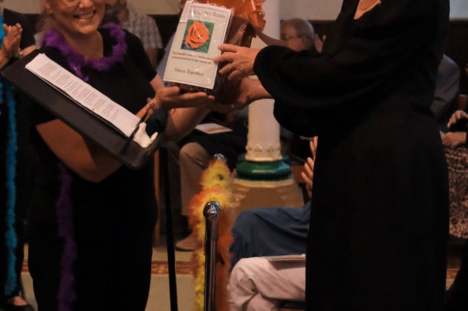 Valerie Hoppé is presented with a Voices Together rose, Spire Church, Farnham, July 1st 2023.