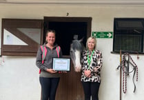 Treloar's presents certificate to Broadlands Riding for the Disabled