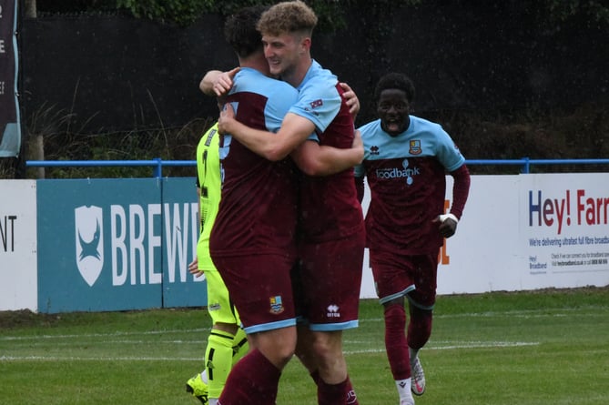 Dean Rule is congratulated after giving Farnham Town the lead