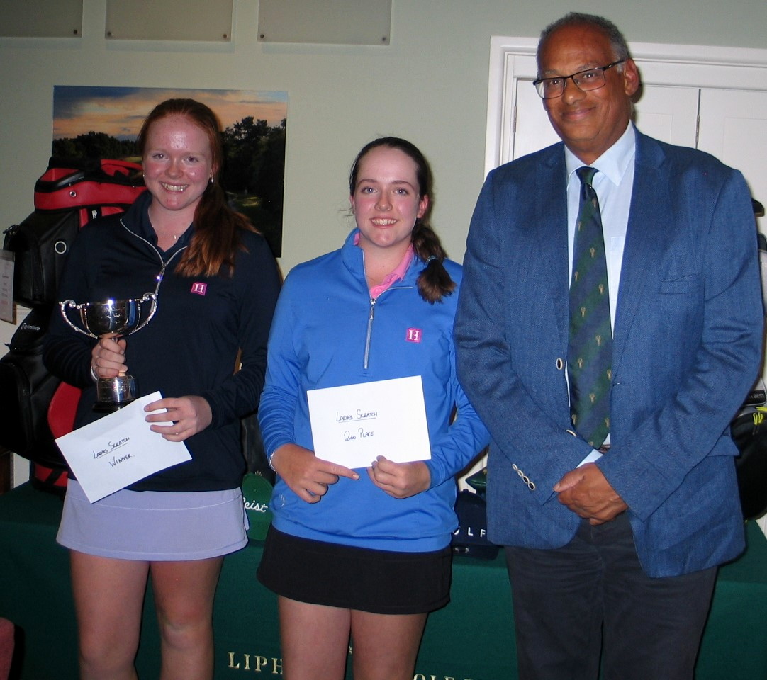 Liphook Scratch Cup winner Annabel Peaford (left) with runner-up Emily Peaford and Liphook captain Siegfried Golding