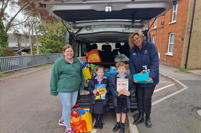 Alton School pupils and staff take harvest festival donations to Alton food bank, October 2023.