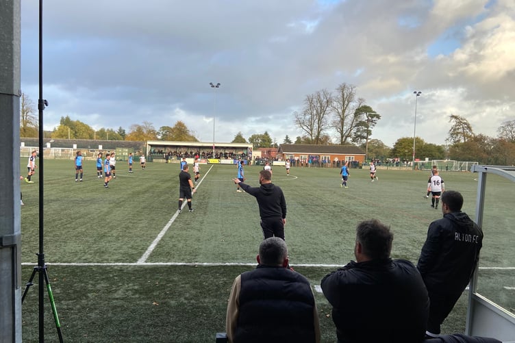 Alton manager Kevin Adair passes on instructions against Fleet