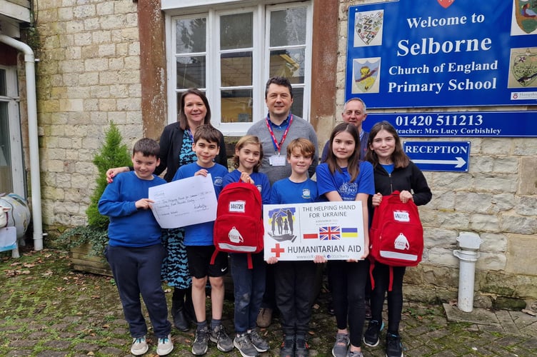Students from Selborne C of E Primary School with their teacher and Simon and Nick Butler.