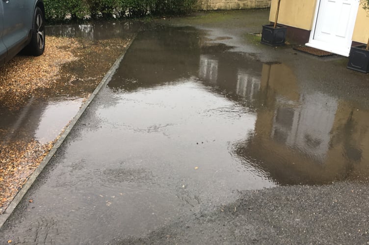 The water coming up to Mr Parson's front door. 