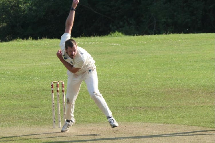 Tilford bowler Huw Town-Jones in action