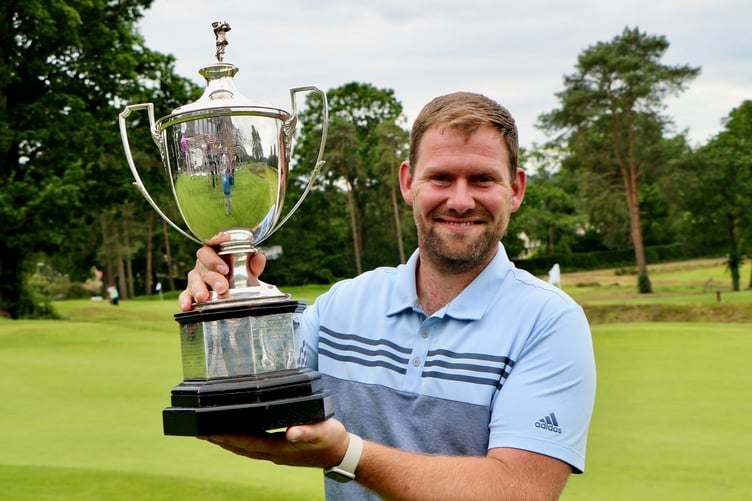 Blackmoor's Sam Parsons holds the Sloane-Stanley Challenge Cup after beating Stoneham's Ryan Henley (Photo: Andrew Griffin/AMG Pictures)