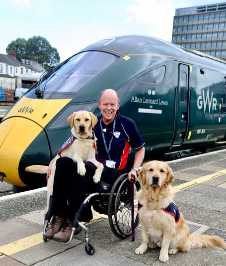Allen with his companion ET, left, and another service dog