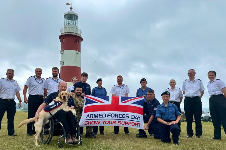 Allen with ET and other members of the Armed Forces with the flag