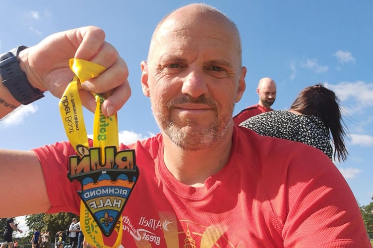 Steve Taylor with his Richmond half marathon medal