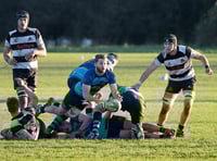 Farnham beat Guildford to remain seven points clear at the top