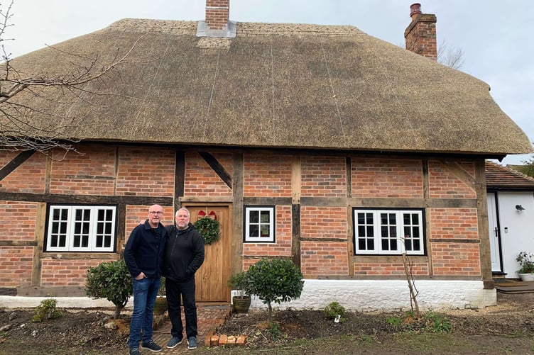 David & Stuart Shrimpton Davis outside their home, Rose Cottage, Clanfield East Hampshire