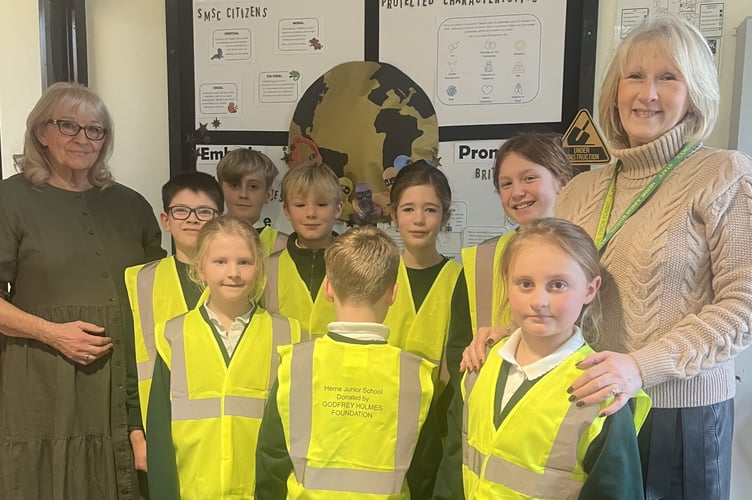 Anouchka Holmes, left, and Headteacher Susan Sayers with Herne School pupils in hi vis jackets