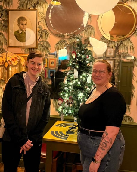 Joe Tully with Clavio general manager Tash beside the giving tree