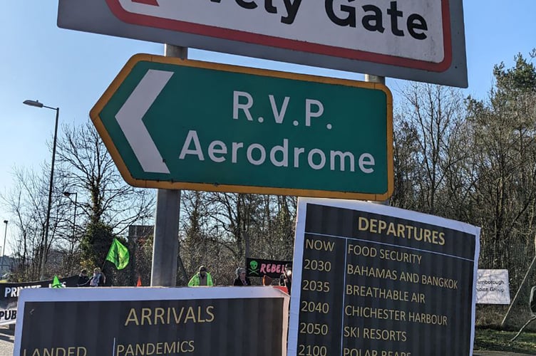 Some of the protesters' boards at Farnborough Airport