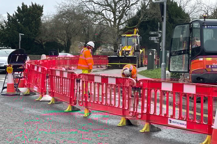 Workers continue with Farnham town centre improvement works at the corner of Downing Street and Long Bridge.
