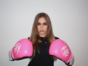 Surrey beauty queen packs a punch in boxing debut