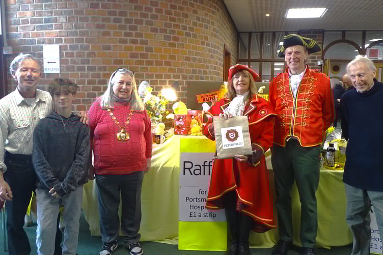Giant Easter Market Petersfield 2025. Left to right: Jeremy Holmes with his son William, mayor Lesley Farrow, town crier Faye Thompson and her deputy, husband Martin Johnson, and Martin Holmes.