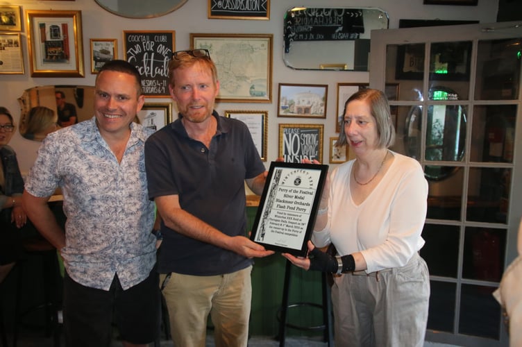 From left: Roy Waby and William Selborne of Blackmoor Estates receive their silver medal certificate from Shirley Hawley, April 2025.
