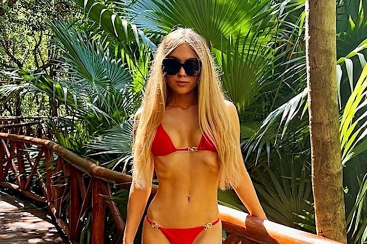 Rheanna Cartier, 21. A woman left 'shy and awkward' after being bullied at school says bikini modelling has given the confidence to be herself - and now shes competing all over the world. Rheanna Cartier, 21, was tormented by classmates during her teenage years but has had the last laugh after becoming a top international bikini model. The criminal law student was left with low self-esteem as a result of the bullying - but says modelling bikinis has completely transformed her confidence. The "real-life Legally Blonde" now spends her days juggling a demanding law career alongside travelling the globe modelling in competitions and pageants. She has just returned to the UK from a Korean beauty competition and now has her sights set on the Swimsuit USA event held in Mexico in October. Rheanna says her personality is now a far cry away from her school days where she was even forced to flee the country to escape the bullying.