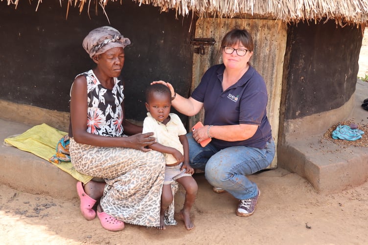 Seeds for Development founder, Alison Hall, with residents in the northern Ugandan villages the charity is supporting.