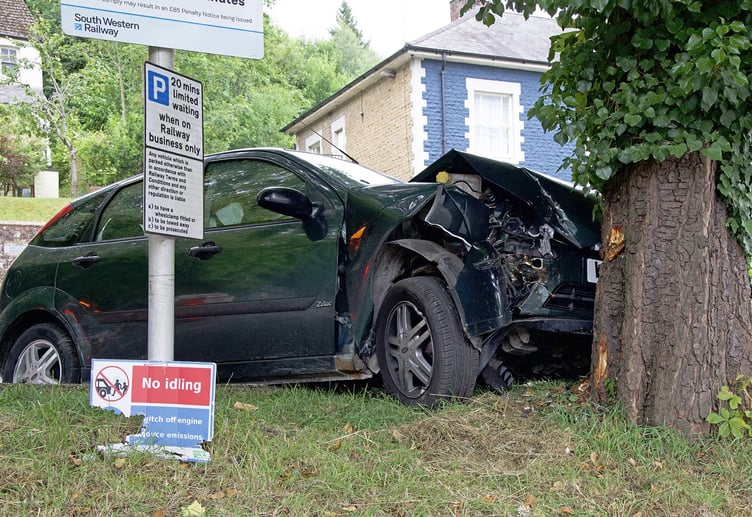 The wrecked Ford Focus after it collided with a tree outside Haslemere station