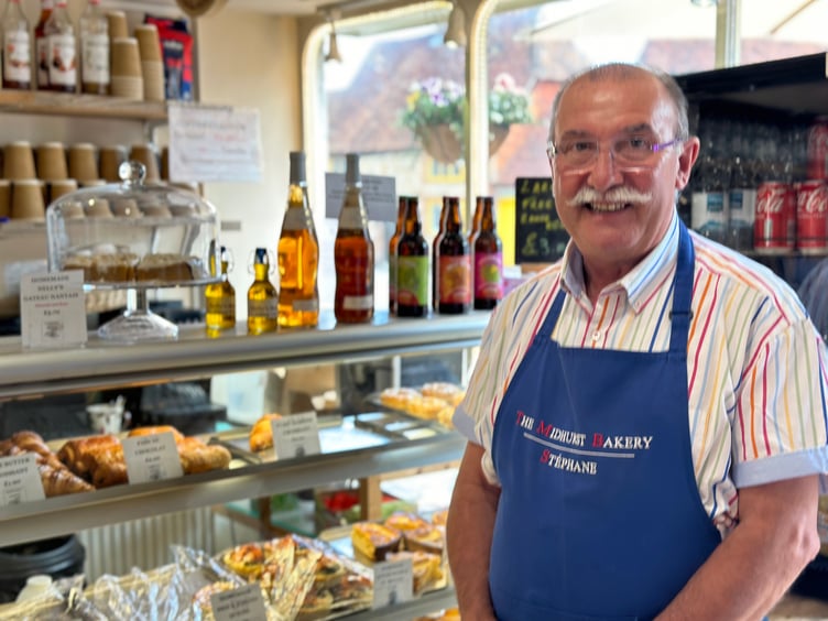 Stephane Jacob, owner of The Midhurst Bakery, wants something done about the ugly scaffolding in the heart of his town