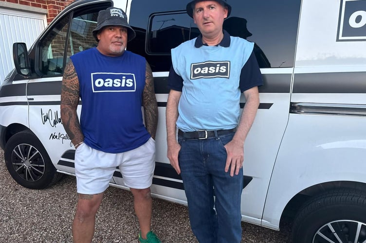 John Smallbones in dark blue Oasis shirt with friend Chris Jackson on right, in light blue Oasis shirt. Photo released July 3 2025. An Oasis superfan who has been to over 40 gigs and spent £14,500 on memorabilia has said he will be camping out before a Wembley performance to show Liam Gallagher a tattoo of his face. John Smallbones, 50, a window surveyor from Andover, Hampshire, has been a fan of the band since 1992 and said he will be sleeping out the night before the July 26 concert in his van, which is Oasis themed.He is hoping to meet Liam, his favourite Gallagher, to tell him that he is not just a random fan. Describing what he would say if confronted with his idol, whose face he has tattooed on his back, he said: A lot of people meet him. Obviously they are fans but they probably dont have what I've got. 
