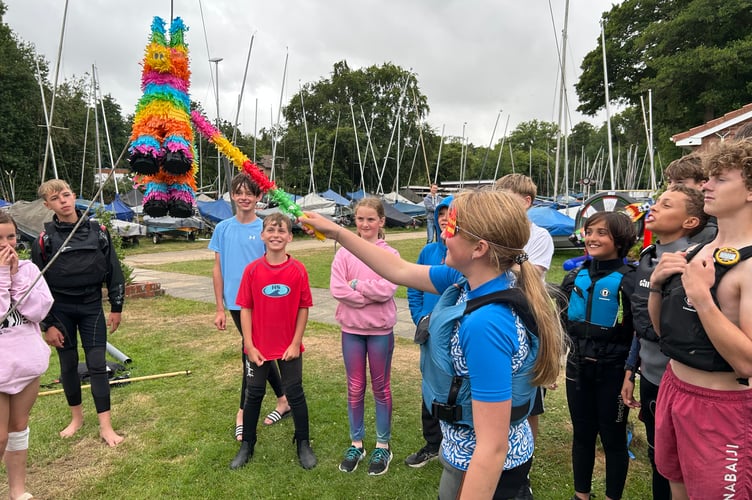 Frensham Pond Sailing Club members enjoyed smashing a piñata during their annual ten-hour race on June 28th 2025.