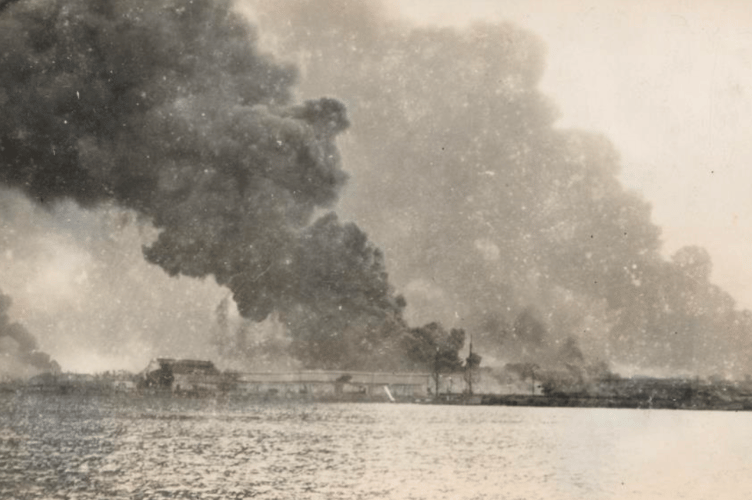 Singapore's oil fields ablaze after Japanese bombing in 1942.