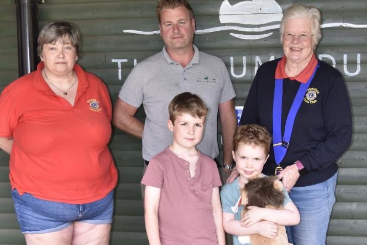 Petersfield Lions on the Heath event winner Rory being presented with his winning prize by club president Lin Piatek, Ian from the Plump Duck, and event organiser Jackie Read.