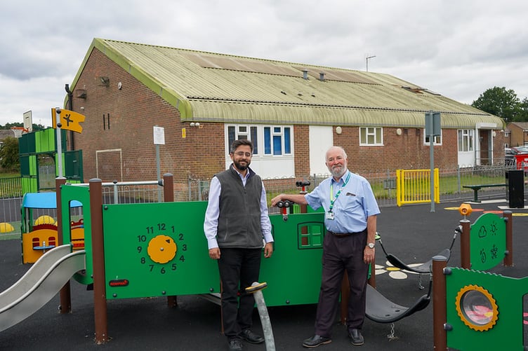 Cllr Adeel Shah and Cllr Anthony Williams at the brand new playpark at Woodlands Hall, Heatherlands, Headley Down