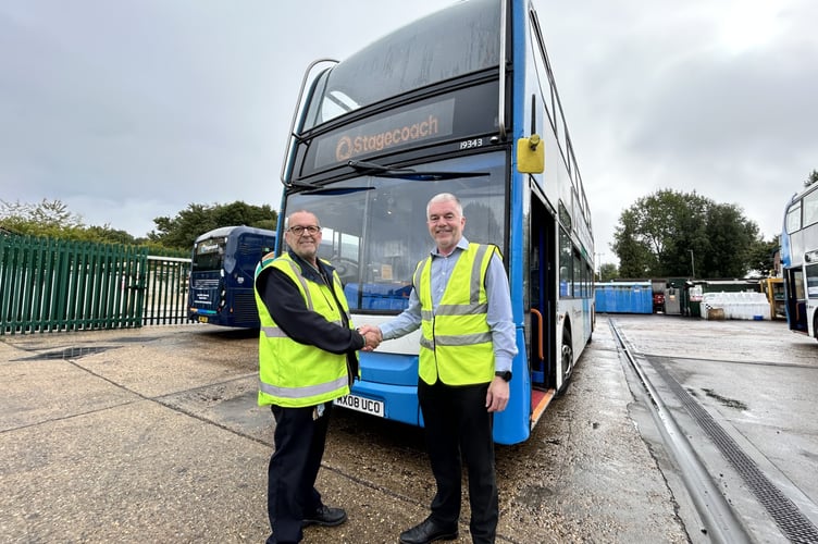 Tim Restall, shakes hands with Graham Harmer, Operations Manager at Stagecoach South