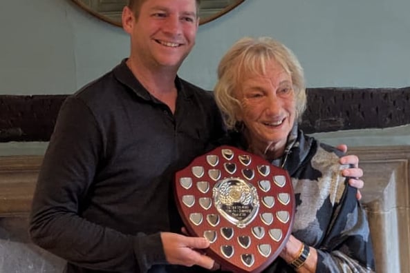 Dave Tink’s widow, Margaret, presents the trophy in her husband’s name to Farnham & District Billiards & Snooker League chairman, Nick Booth