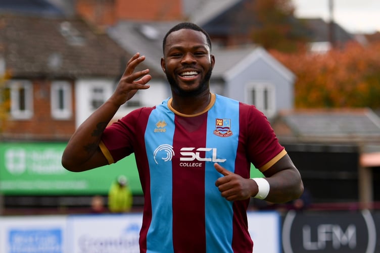 Ogo Obi celebrates after scoring Farnham Town's opening goal against Bishop's Cleeve